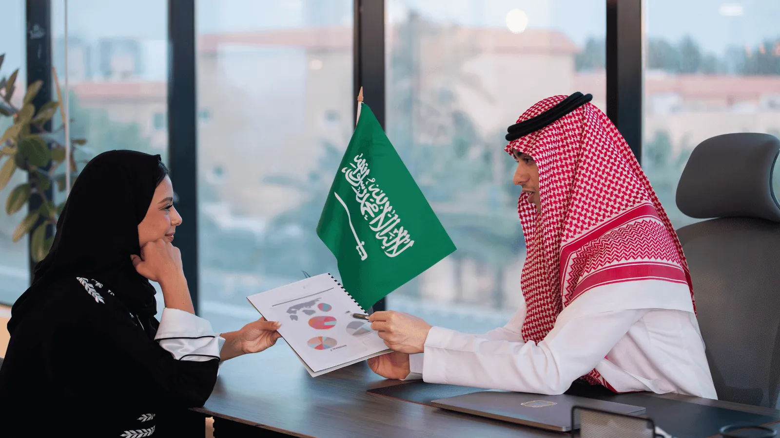 A11 consultants reviewing a report with a client